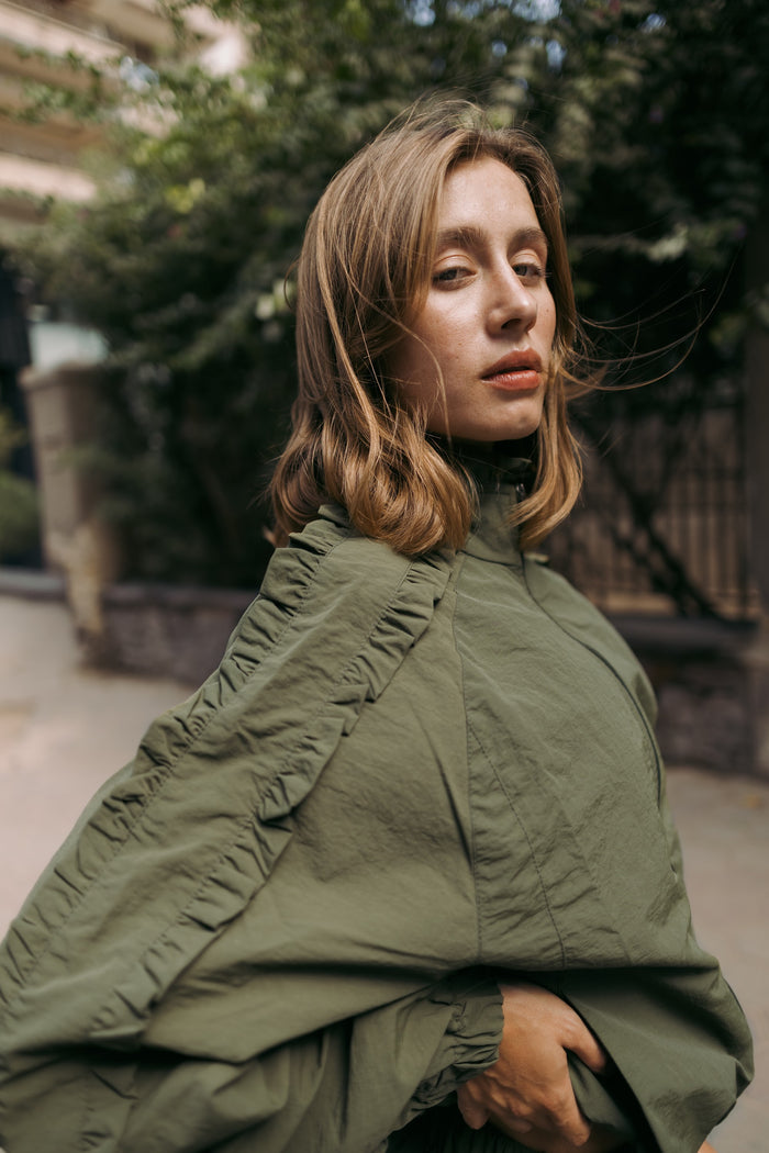 Ruffle trim on the olive shoulder