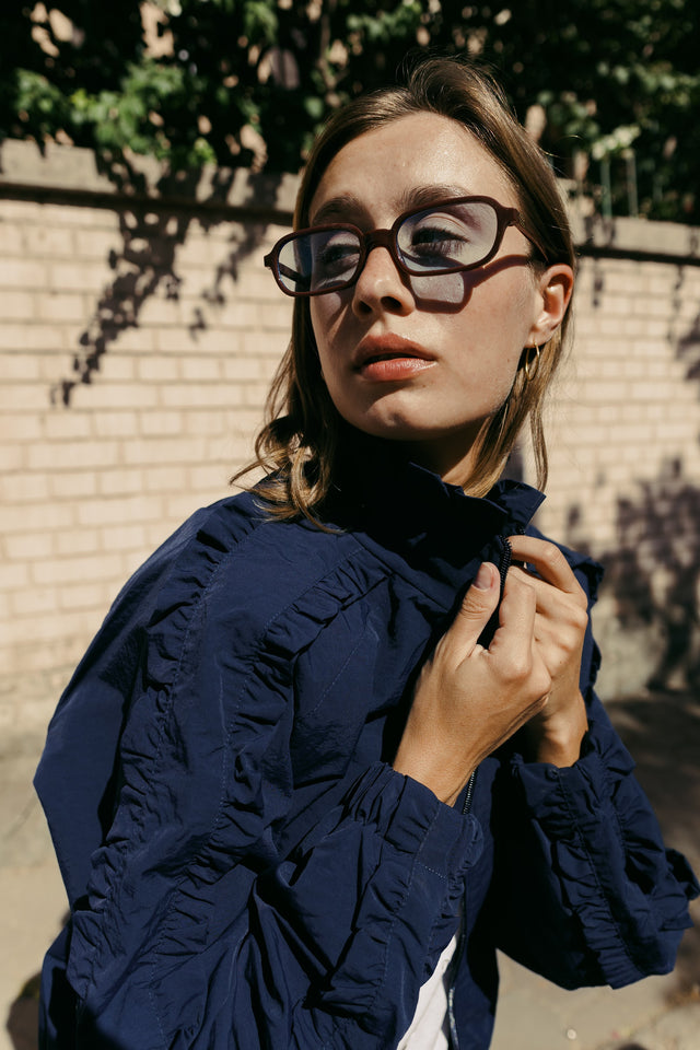 Close-up of the navy ruffle collar