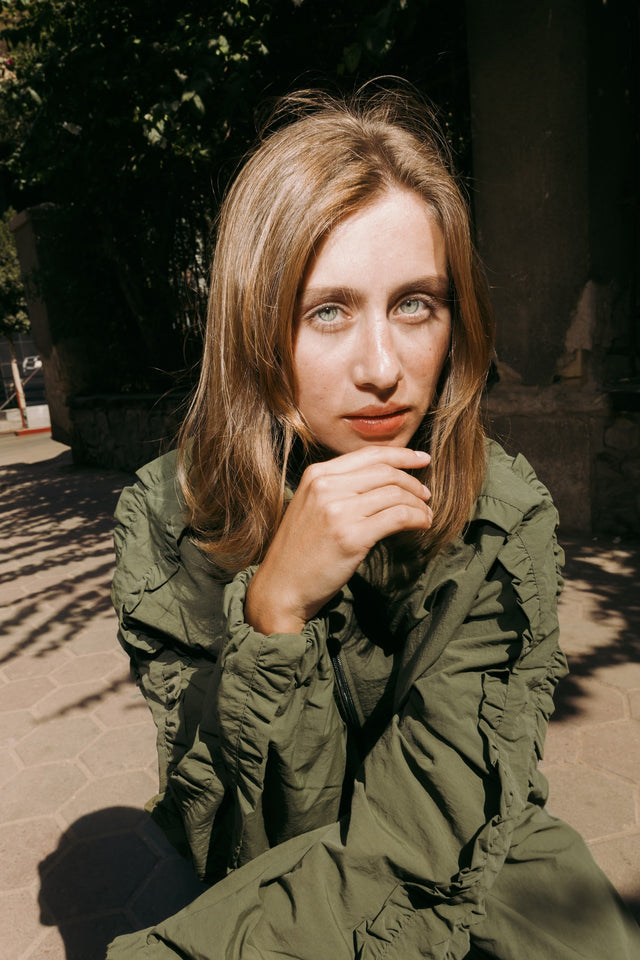 Close-up in the olive jacket